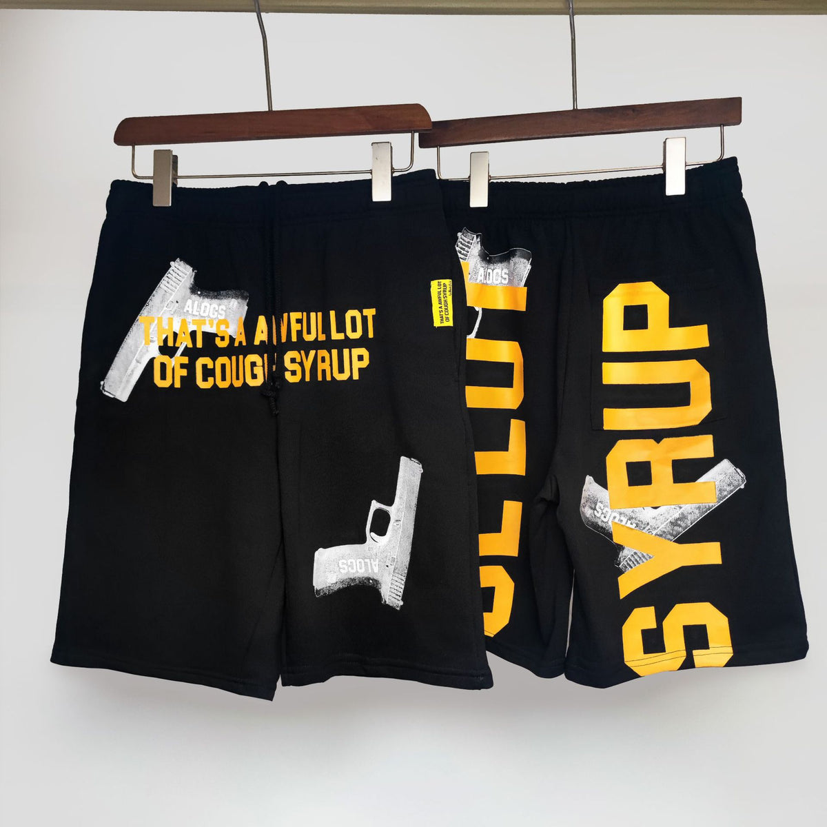 COUGH SYRUP Black Yellow Graphic Print Shorts